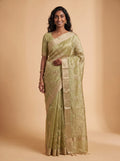 Model wearing pista green ready-to-wear kota tissue saree with floral zari embroidery and contrasting border