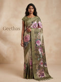 Model wearing an olive green floral printed semi tussar saree with a striped pallu border