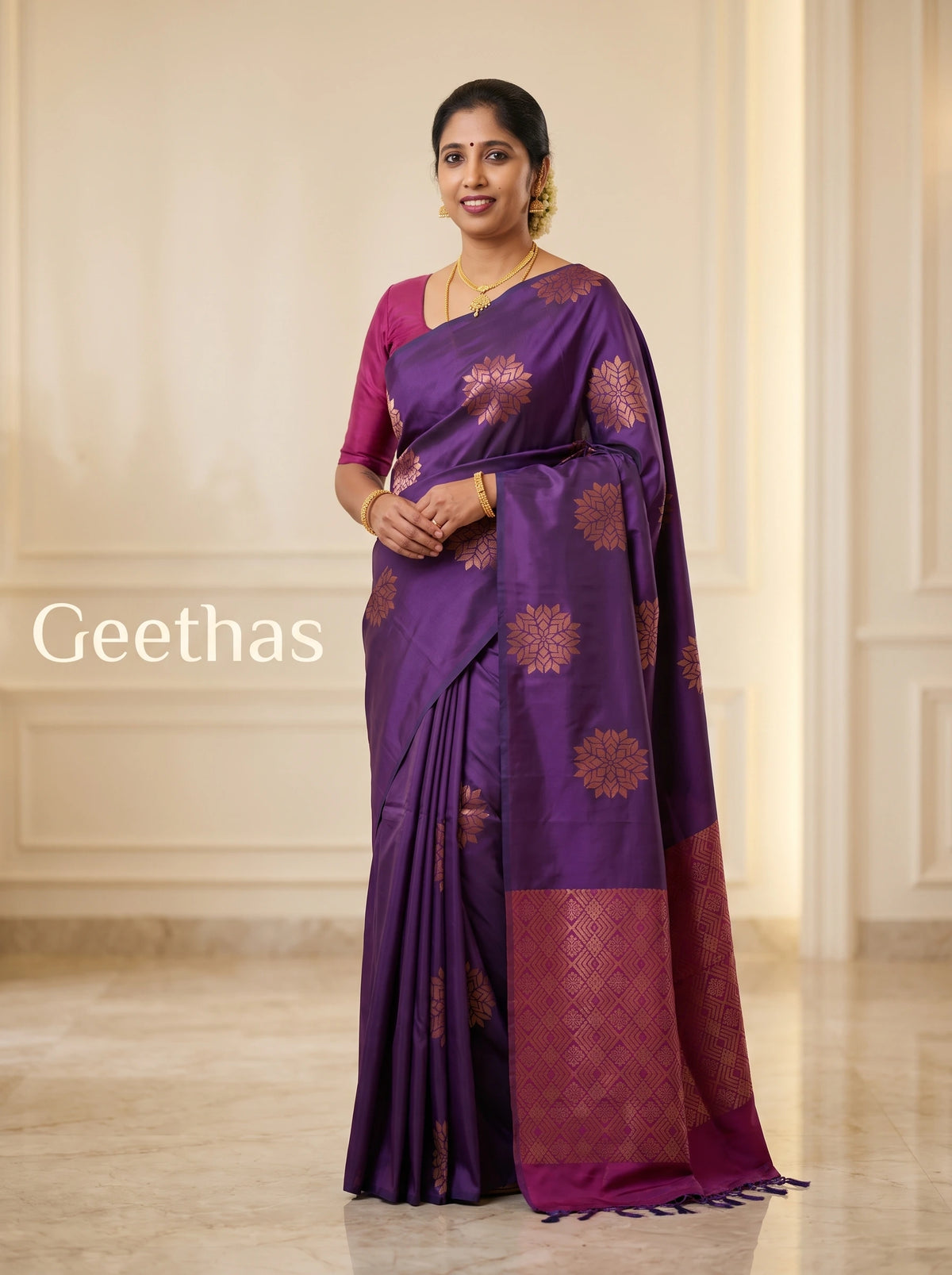 Model wearing a violet soft silk saree with woven floral motifs and a geometric pallu panel