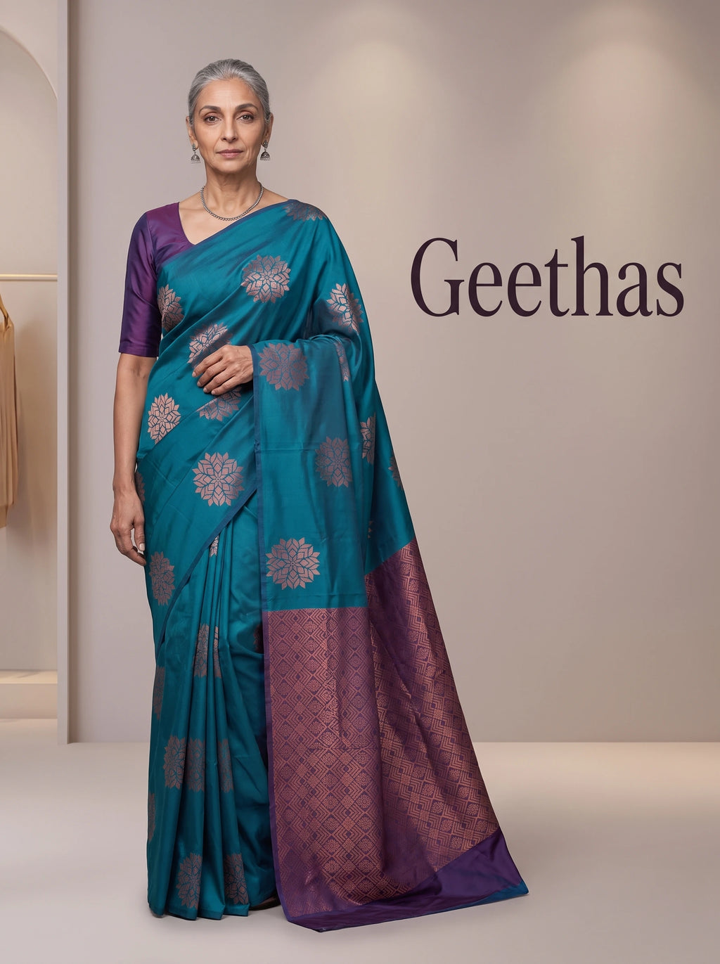 Model wearing teal blue soft silk saree with woven motifs and a contrast deep purple geometric pallu