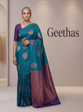 Model wearing teal blue soft silk saree with woven motifs and a contrast deep purple geometric pallu