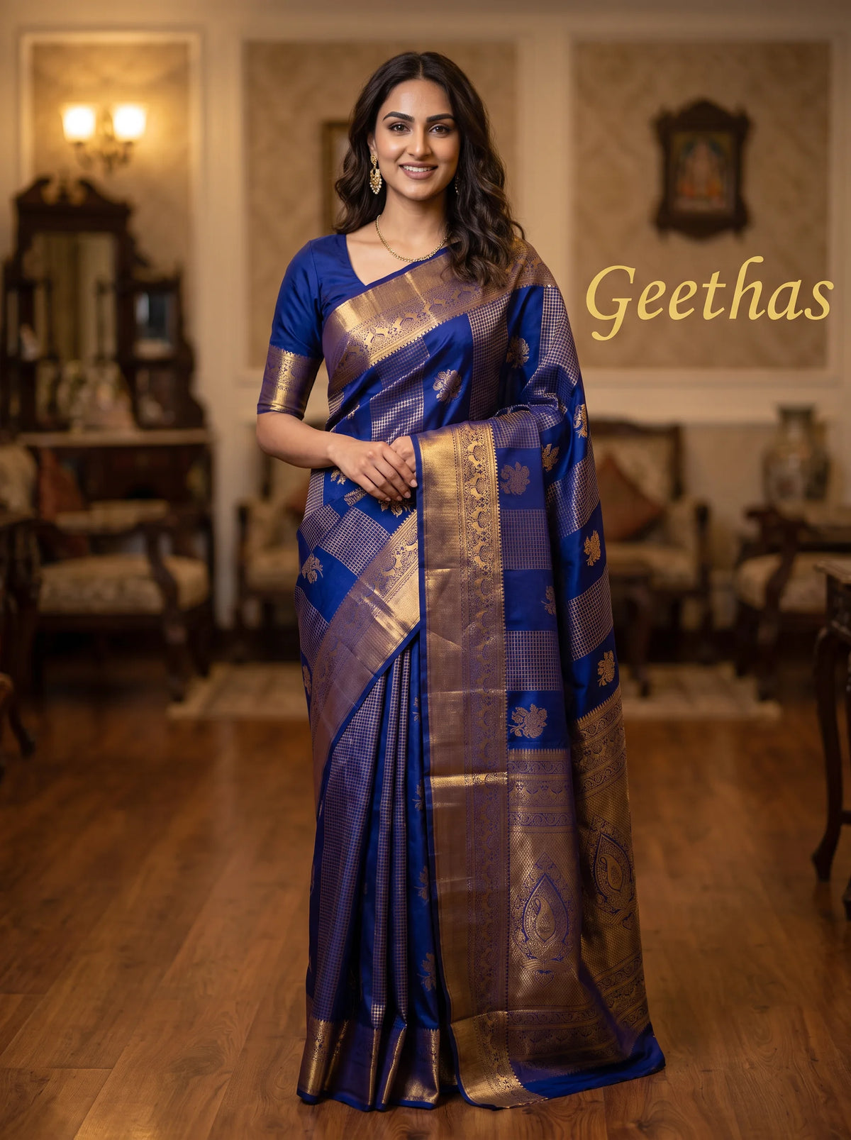 Model wearing a royal blue soft silk saree with gold-tone woven motifs and a detailed zari border