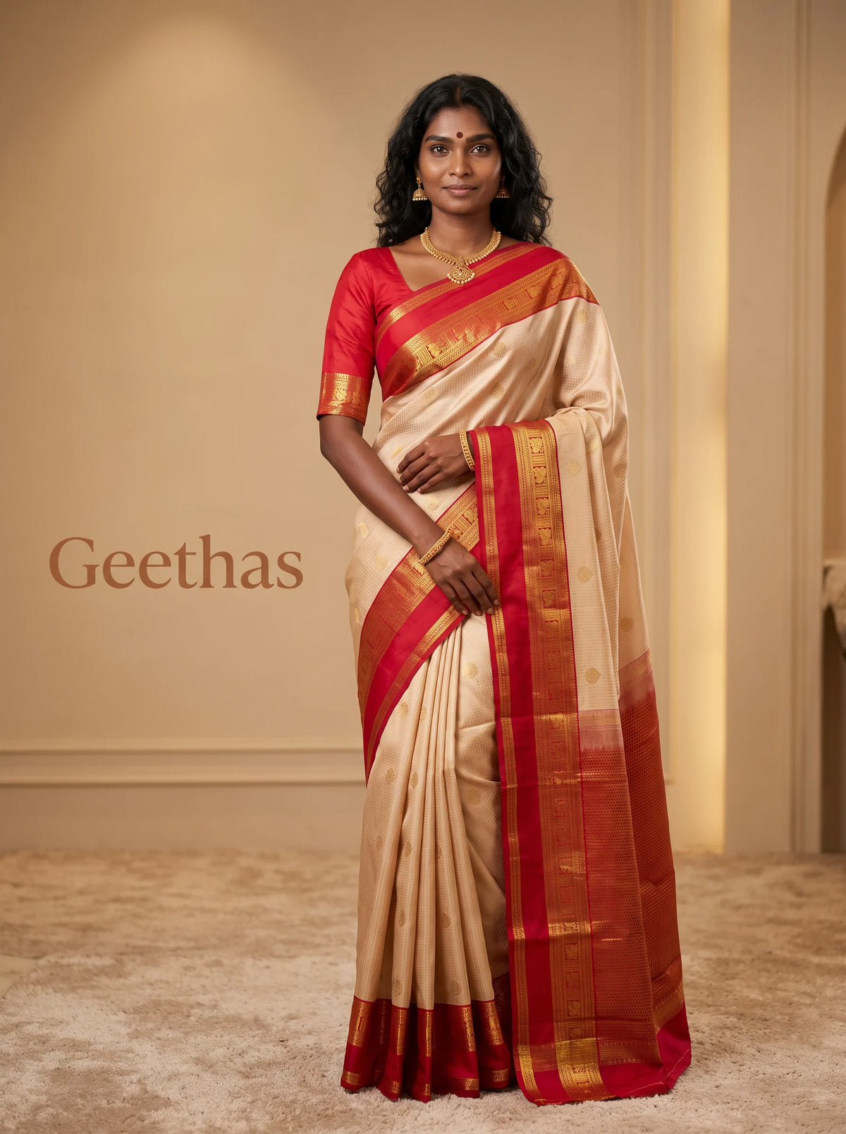 Model wearing an off-white soft silk saree with bright red and gold-toned zari border