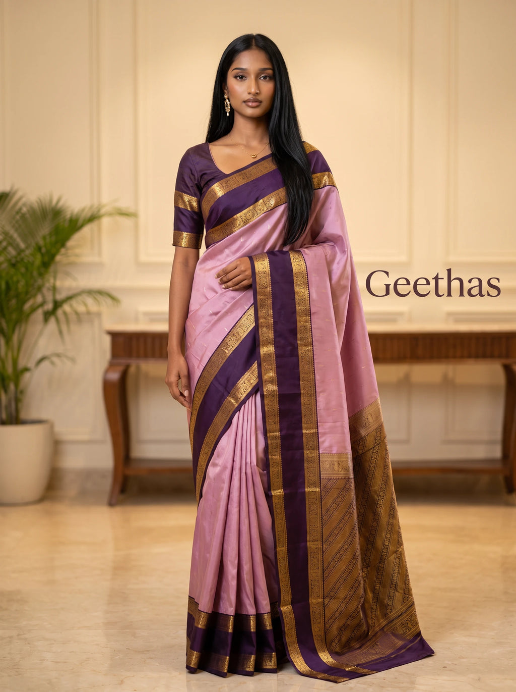 Model wearing an onion pink soft silk saree with a contrasting purple zari border and pallu