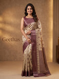 Model wearing beige tissue soft silk saree with burgundy woven motifs, border and pallu